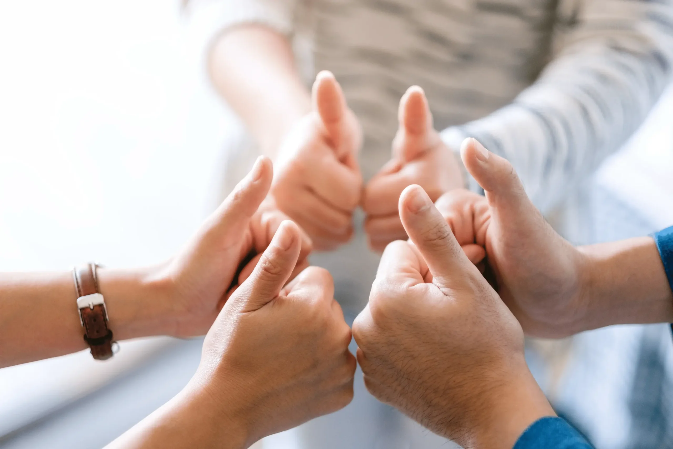 people-making-thumb-up-sign-in-circle-2024-11-29-19-33-03-utc (1) (1) (1)